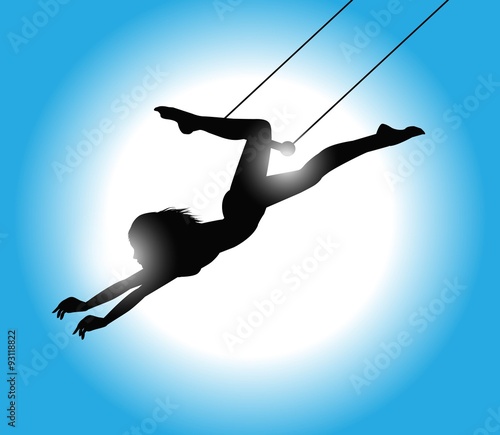 Obraz na plátně silhouette di trapezista con luce sullo sfondo