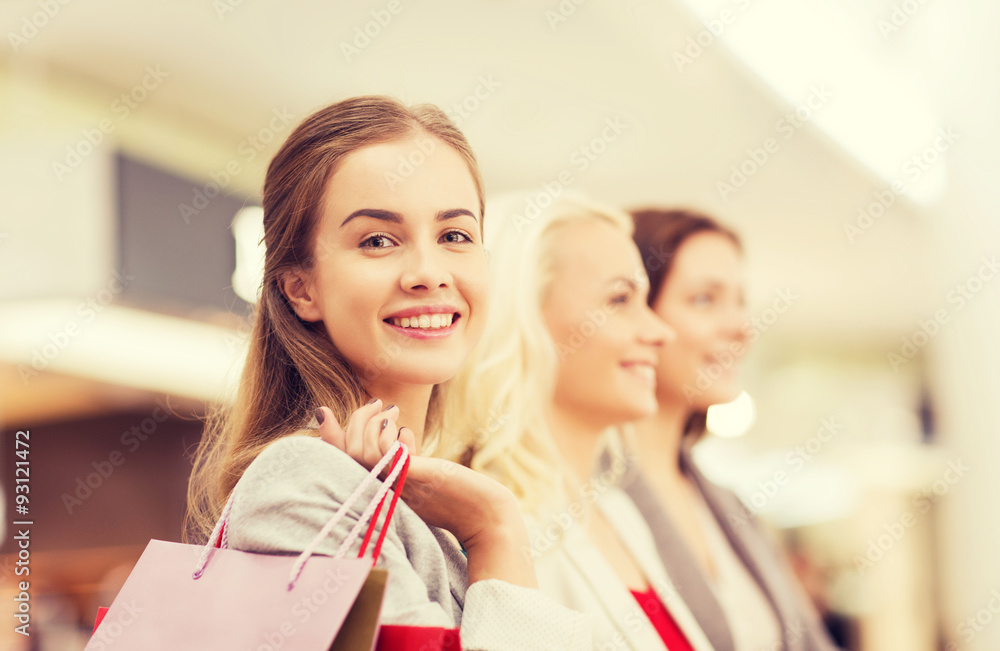 happy young women with shopping bags in mall happy young women with shopping bags in mall
