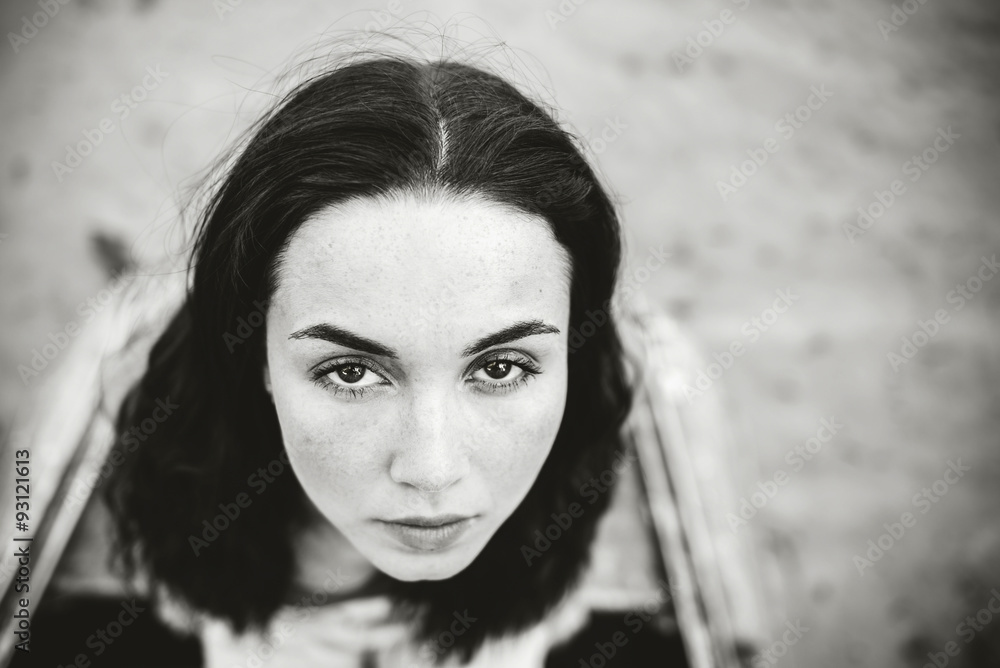 Portrait of young girl outdoor looking up