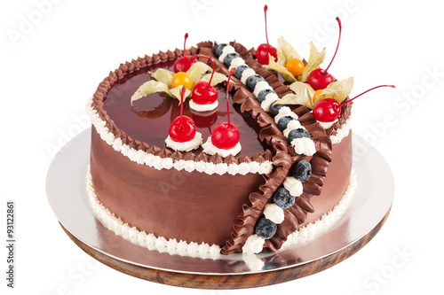 Traditional chocolate cake decorated with cream  cherries and bl