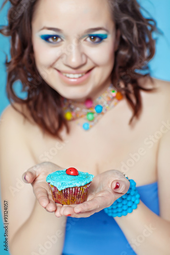 portrait of beautiful woman with cakes 