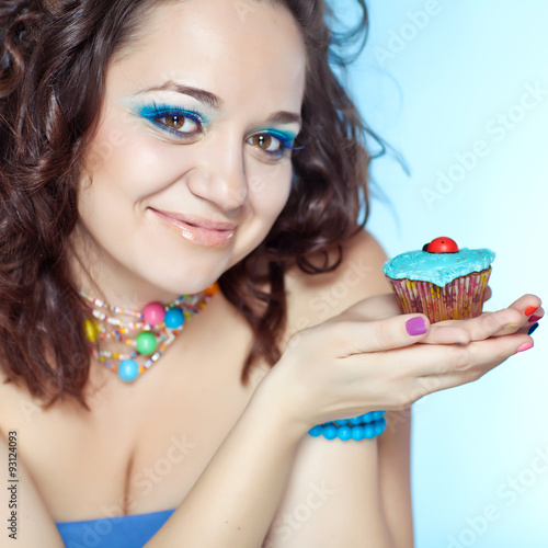 portrait of beautiful woman with cakes 