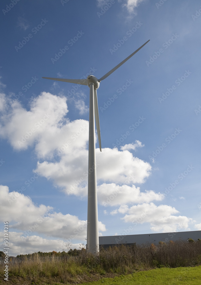 Wind Energy. A mighty wind generator provides energy for an industrial park in England. Wind Energy. A mighty wind generator provides energy for an industrial park in England.