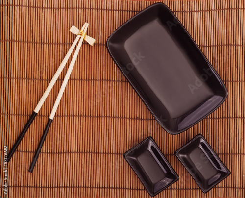 black plate on a bamboo background