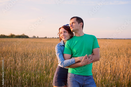 happy couple in love in the field