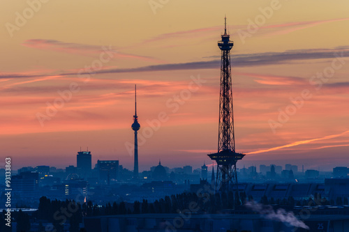 Berlin skyline with TV tower and radio tower before sunrise.