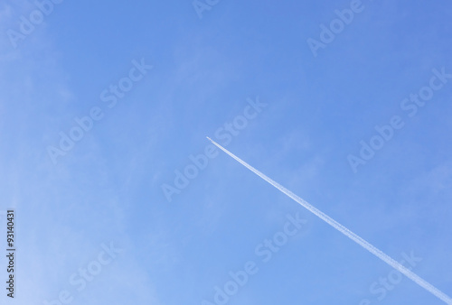Plane flying high in the sky above earth.