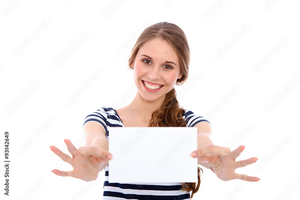 Student girl showing white blank sheet - copy space, isolated over background Student girl showing white blank sheet - copy space, isolated over background