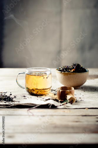 Green tea in a glass cup with steam