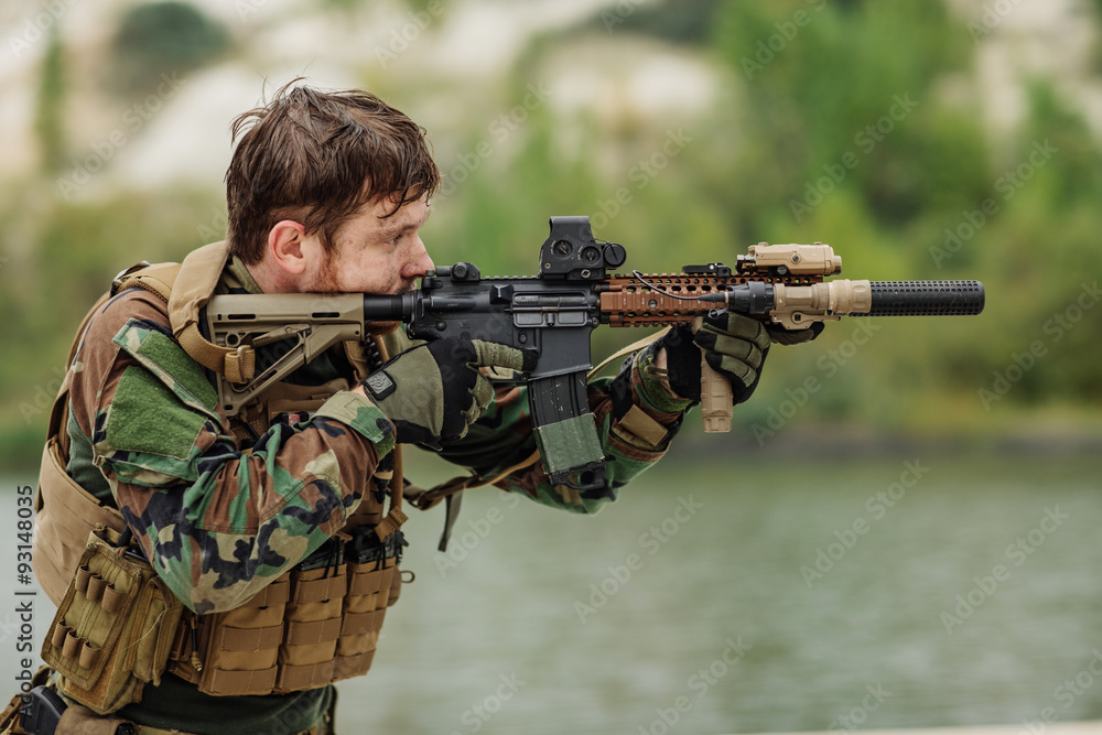 Fototapeta premium rangers to aim and shoot at a target with automatic weapons