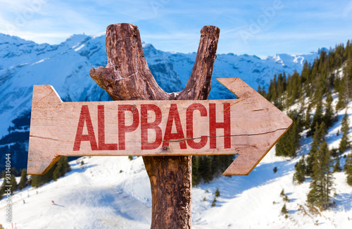 Alpbach wooden sign with winter background photo