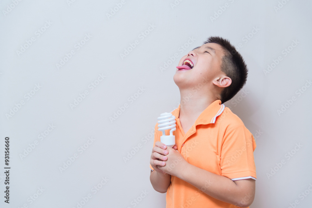 Asian boy joking gesture licking fake ice cream made with energy Asian boy joking gesture licking fake ice cream made with energy