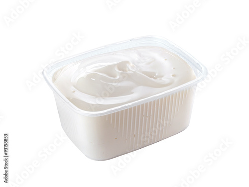 plastic container with sour cream isolated on white background
