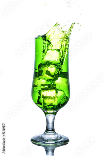 Green alcohol cocktail with splash isolated on white