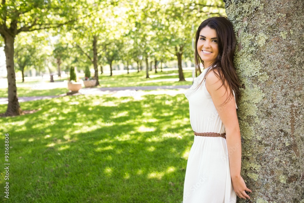Portrait of happy woman leaning on tree Portrait of happy woman leaning on tree