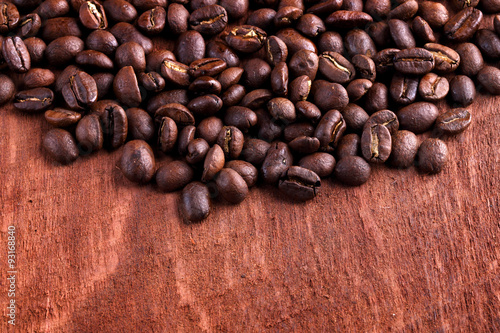 Thai roasted coffee beans on wooden background