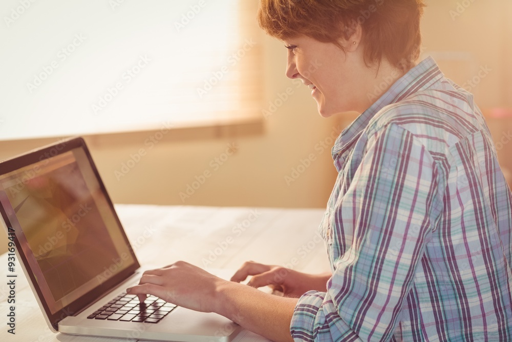 Casual businesswoman using her laptop Casual businesswoman using her laptop