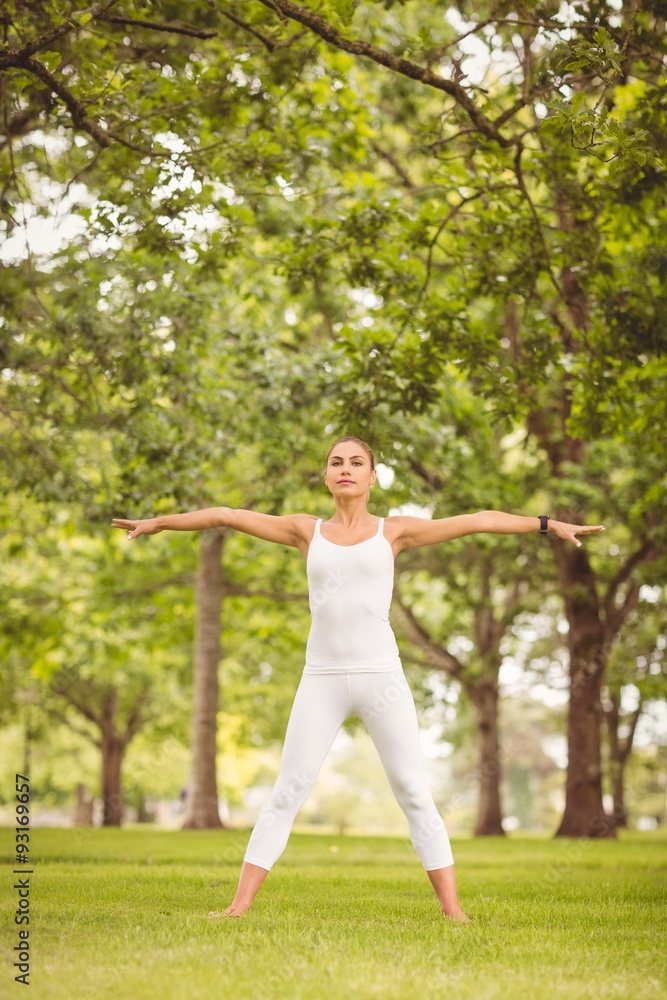 Confident woman exercising in a park Confident woman exercising in a park