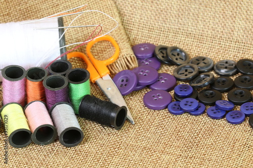 tools for needlework thread scissors and tape measure photo