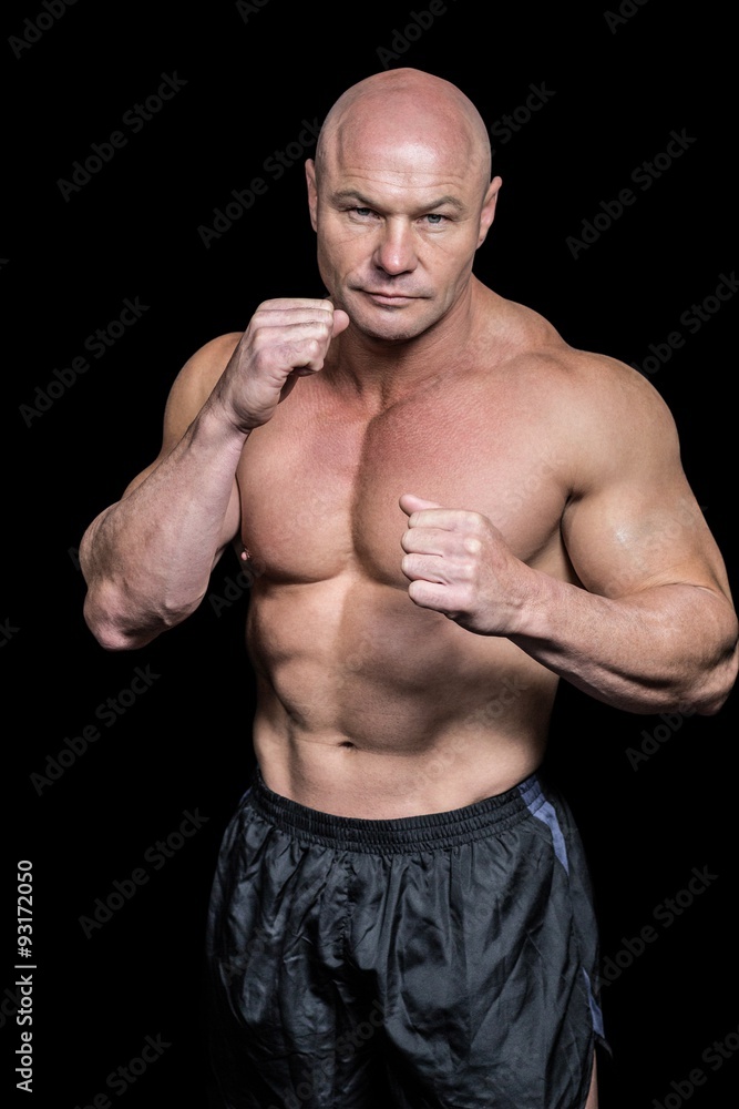Portrait of bald man with boxing pose Portrait of bald man with boxing pose