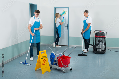 Janitors Cleaning Corridor