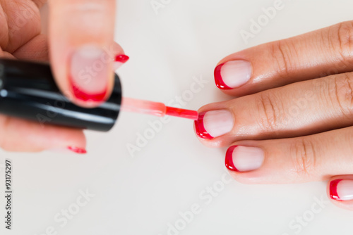 Female Hands Applying Nail Varnish