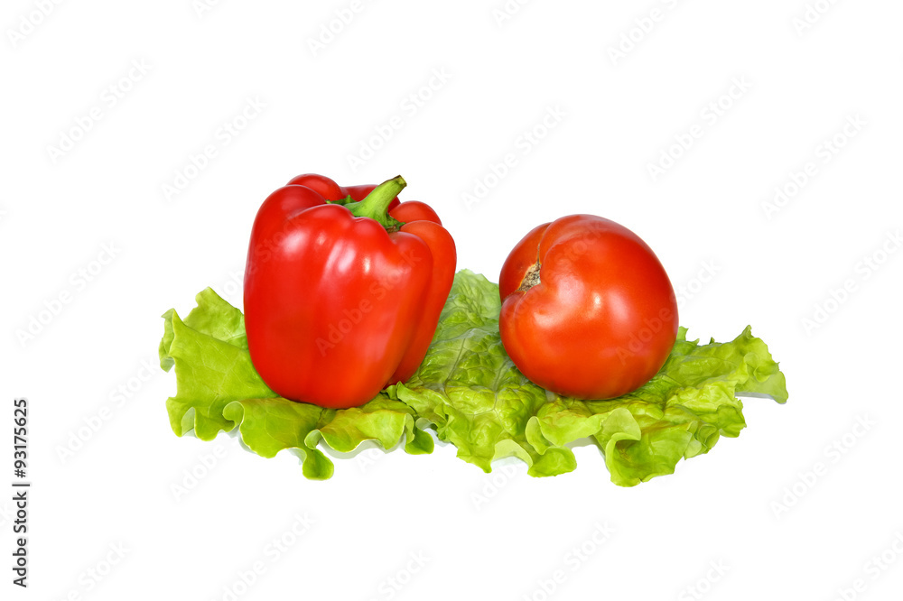 Beautiful red pepper and tomato on lettuce leaves. Beautiful red pepper and tomato on lettuce leaves.