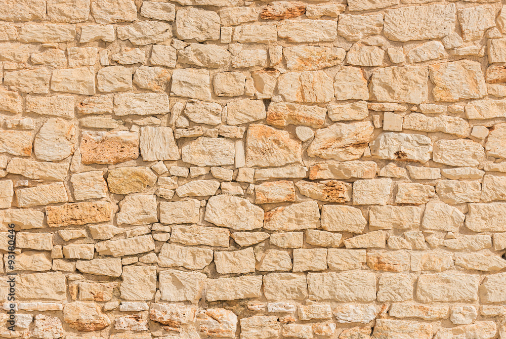 Naklejka Kamienna ściana stara lekka beżowa tło tekstury struktura