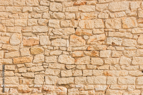 Kamienna ściana stara lekka beżowa tło tekstury struktura
