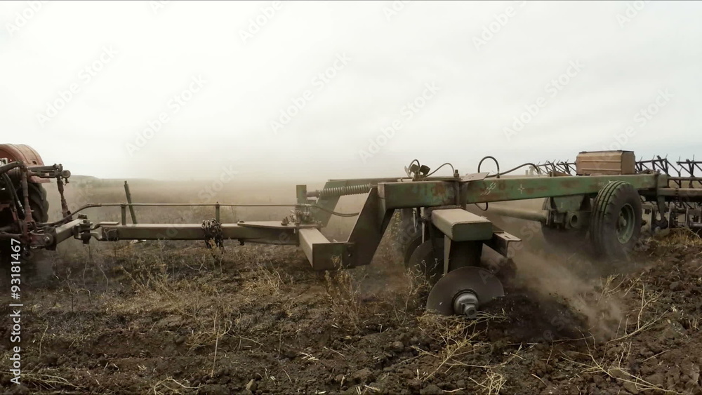 Agricultural Tractor Plowing Rural Field Agricultural Tractor Plowing Rural Field
