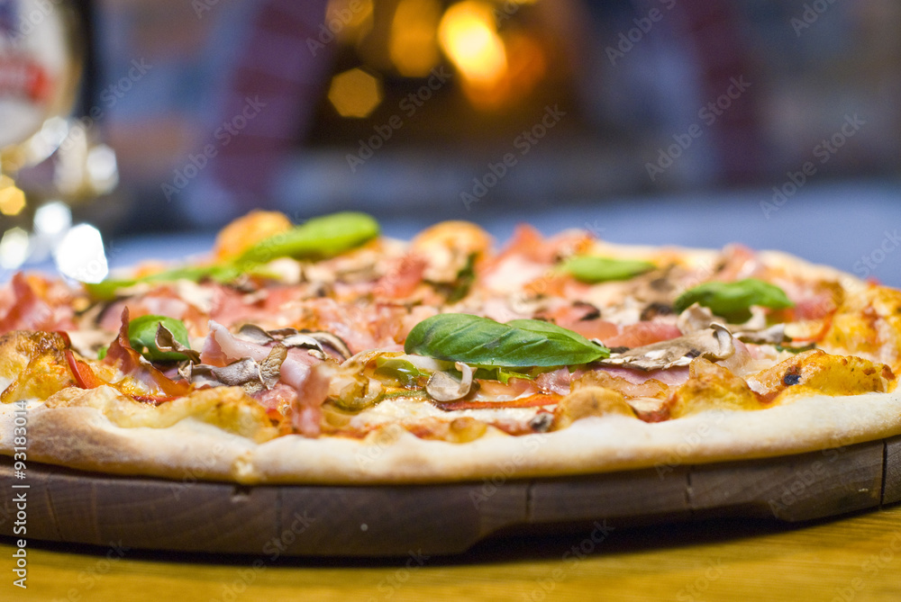 Pizza capricciosa with ham and mushrooms