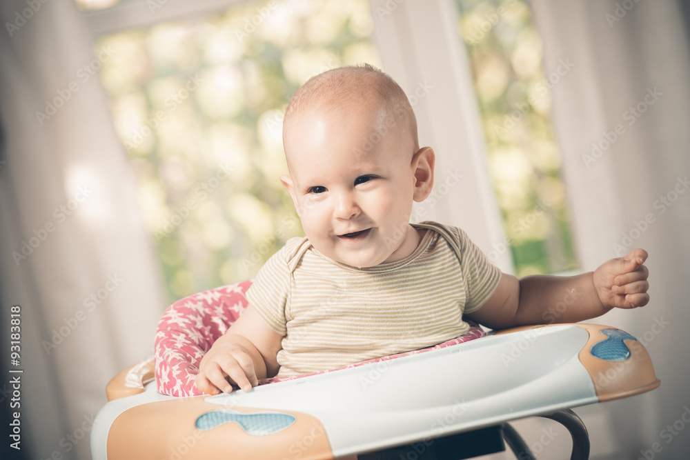 smiling baby boy in the baby walker smiling baby boy in the baby walker