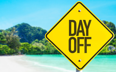 Day Off sign with beach background