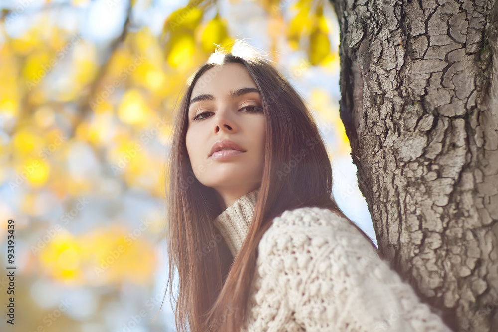Beautiful woman in a sweater in park Beautiful woman in a sweater in park