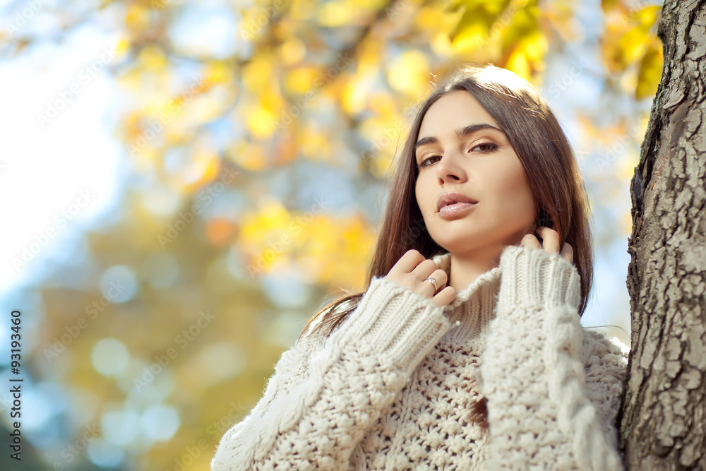Beautiful woman in a sweater in park Beautiful woman in a sweater in park