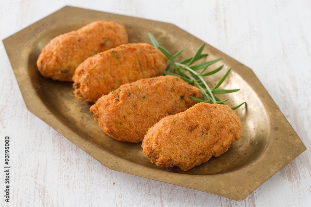codfish croquettes on dish on white background codfish croquettes on dish on white background