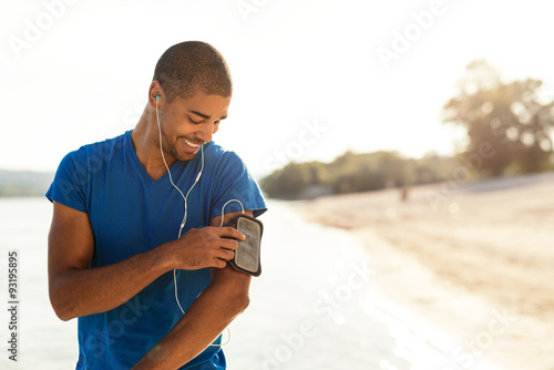  Choosing his favorite workout music photo