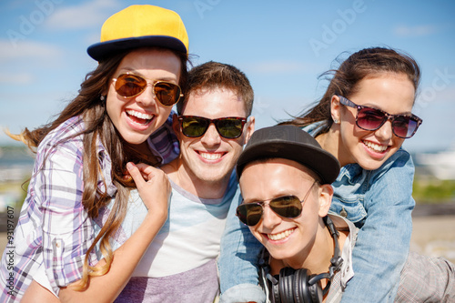 group of smiling teenagers hanging out