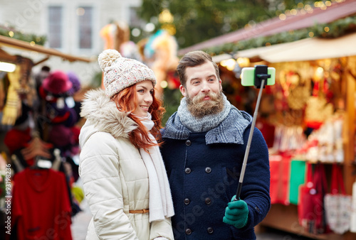 couple taking selfie with smartphone in old town