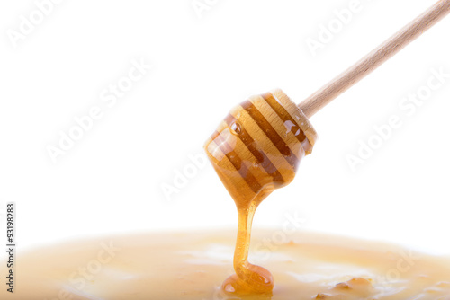 stick with honey on white background