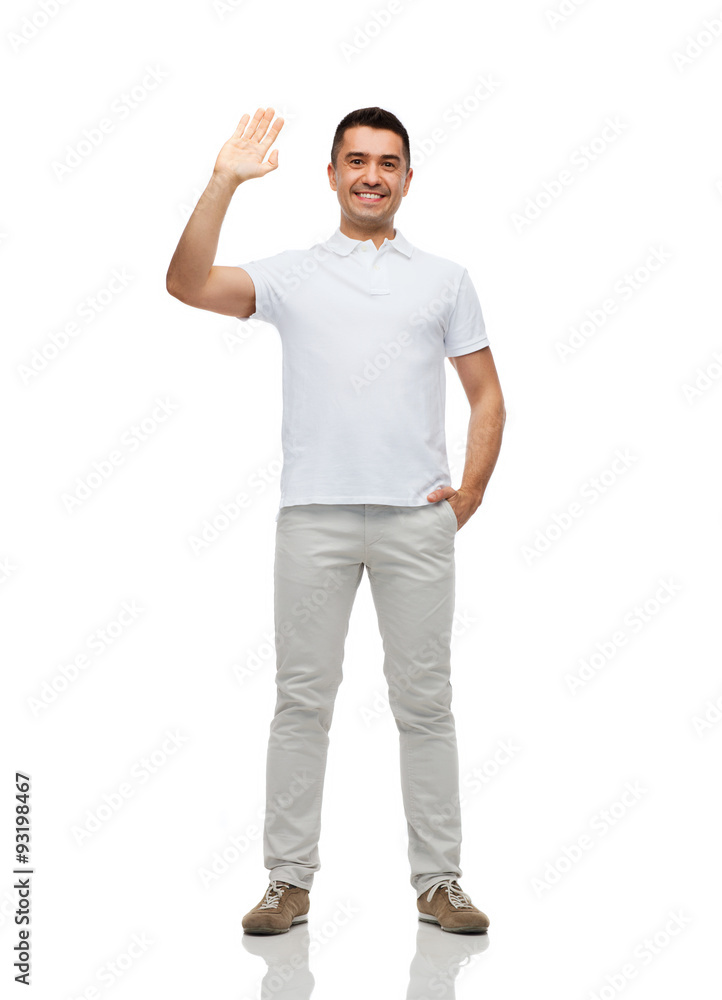 smiling man in blank white t-shirt waving hand smiling man in blank white t-shirt waving hand
