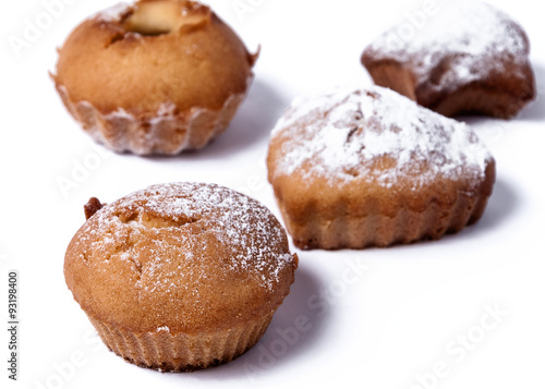 Delicious baked muffins on a white background