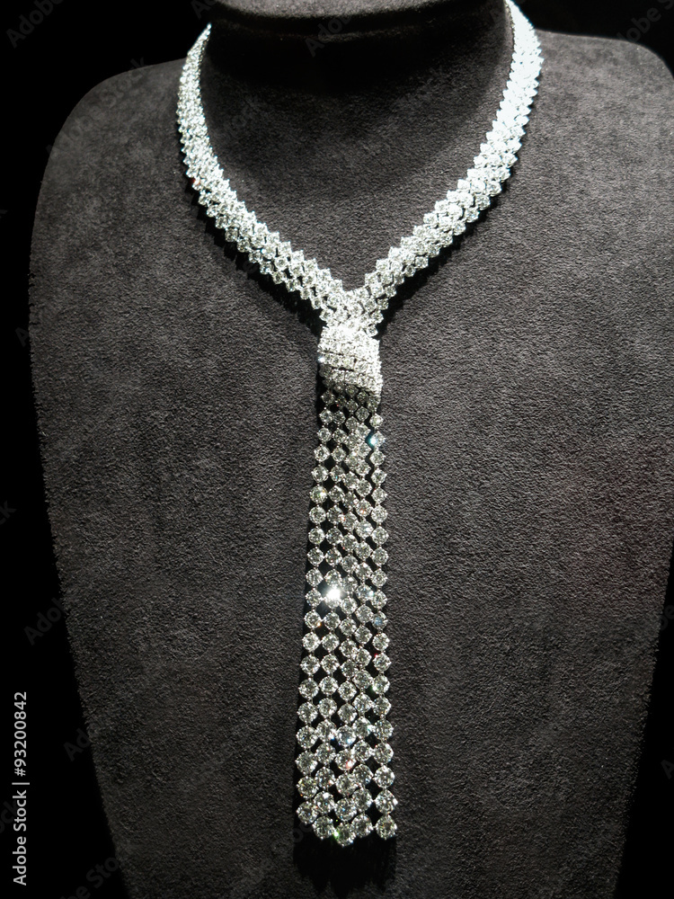Necklace made of white gold with diamonds on a stand. Necklace made of white gold with diamonds on a stand.