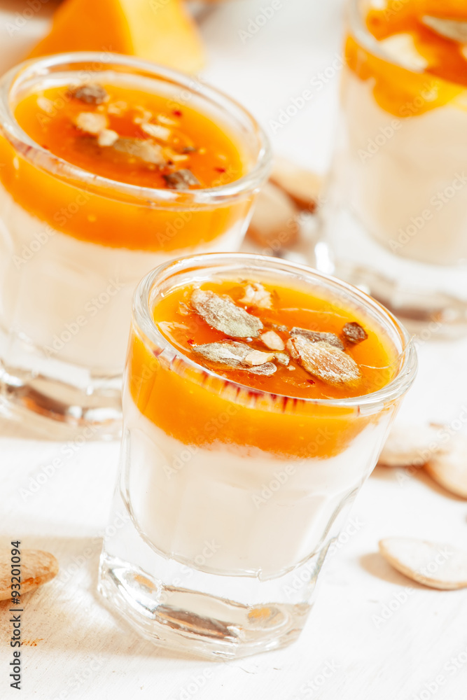 Pumpkin dessert with homemade yogurt and pumpkin seeds in a smal Pumpkin dessert with homemade yogurt and pumpkin seeds in a smal