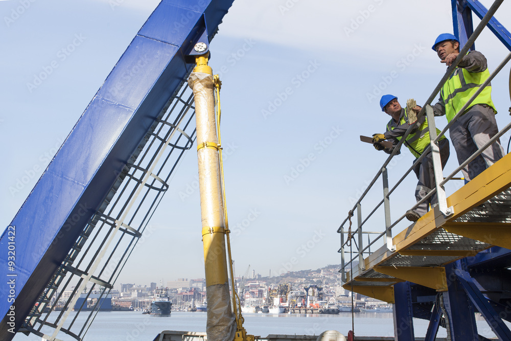 Crew working onboard a ship 스톡 사진 | Adobe Stock