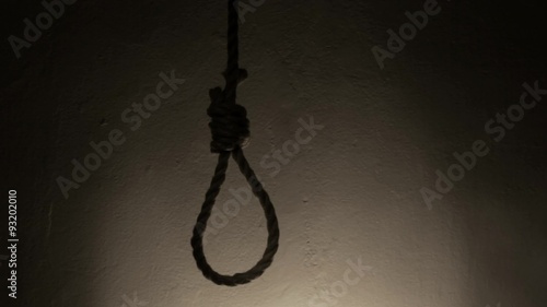 Rope noose in dark light photo