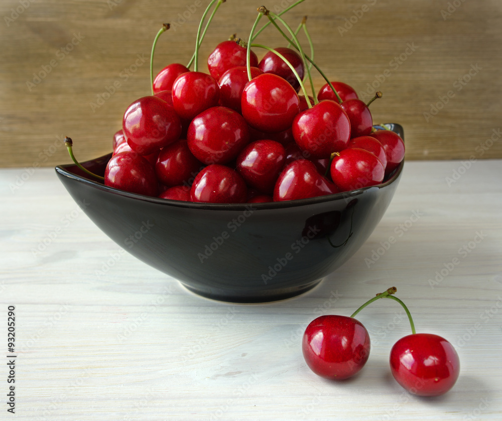 Fresh cherries in bowl on table Fresh cherries in bowl on table