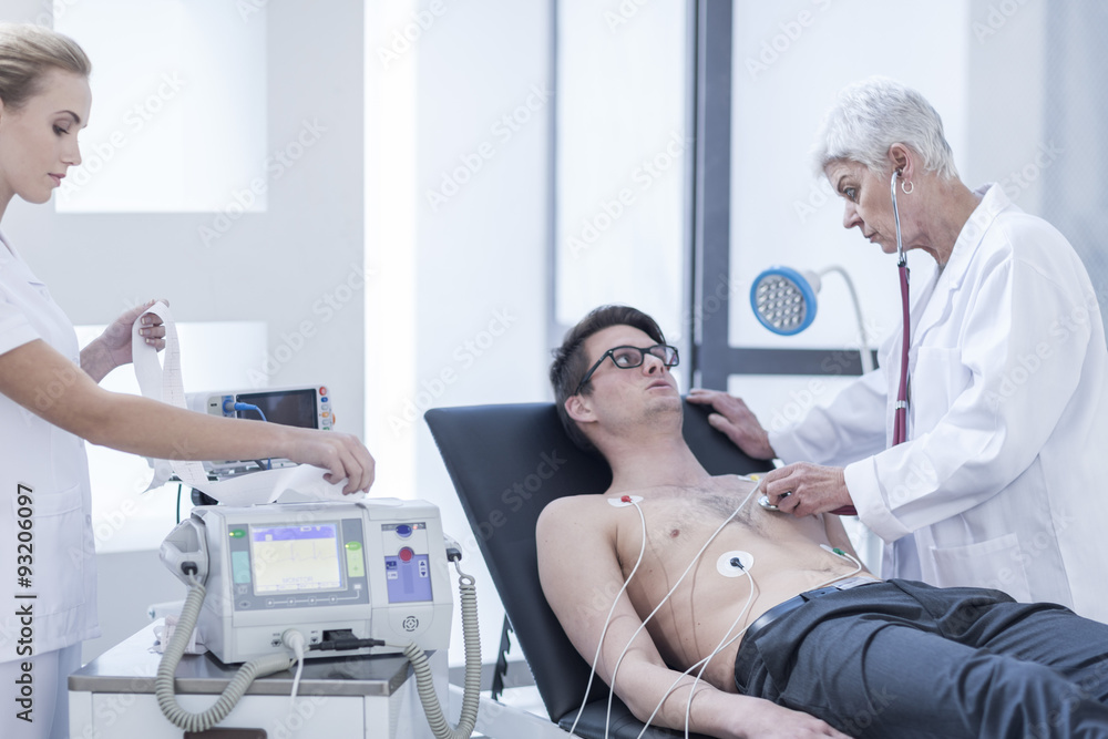 Young man in hospital getting heart rate monitored Young man in hospital getting heart rate monitored