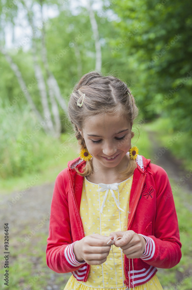 Germany, Girl preparing fishing line Germany, Girl preparing fishing line