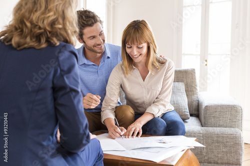 Young couple owners meeting real estate agent for investment